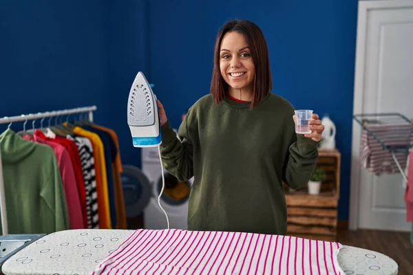 Young Beautiful Hispanic Woman Smiling Confident Holding Iron Water Laundry — Stok fotoğraf