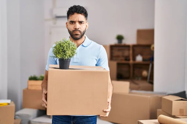Hispanic Man Beard Moving New Home Holding Box Skeptic Nervous — Stock Photo, Image