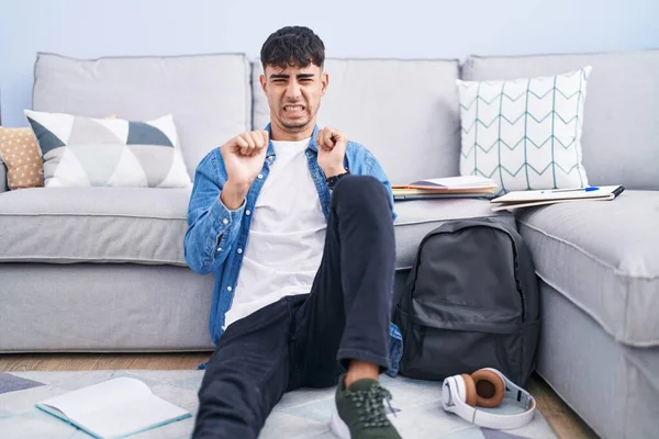 Young Hispanic Man Sitting Floor Studying University Disgusted Expression Displeased — Stock Photo, Image
