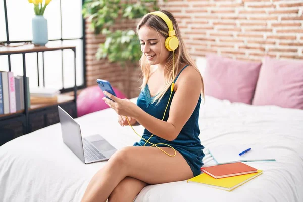 Young Blonde Woman Student Listening Music Sitting Bed Bedroom — Stockfoto