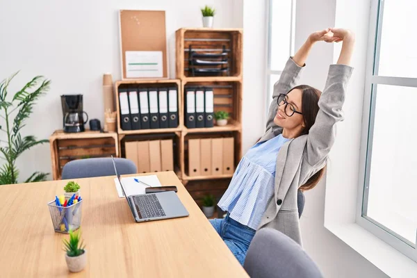stock image Young beautiful hispanic woman business worker relaxed stretching arms at office