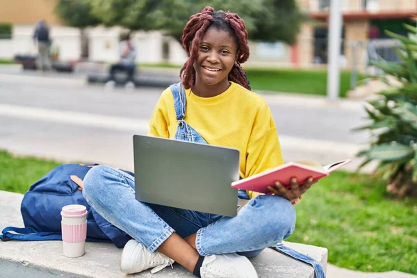 African American Woman Student Using Laptop Reading Book Campus Park — Stok fotoğraf