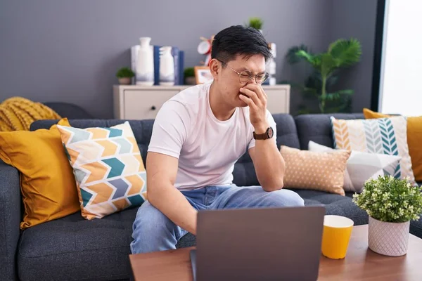 Young Asian Man Using Laptop Home Sitting Sofa Smelling Something — Stock Photo, Image