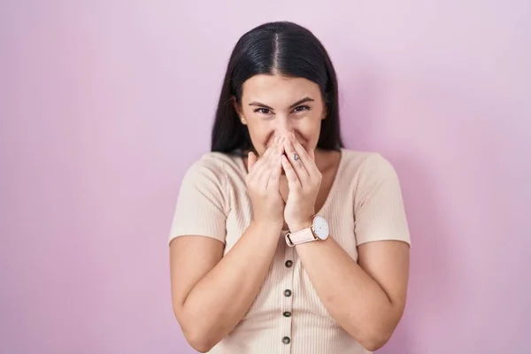 Young Hispanic Woman Standing Pink Background Laughing Embarrassed Giggle Covering — Fotografia de Stock