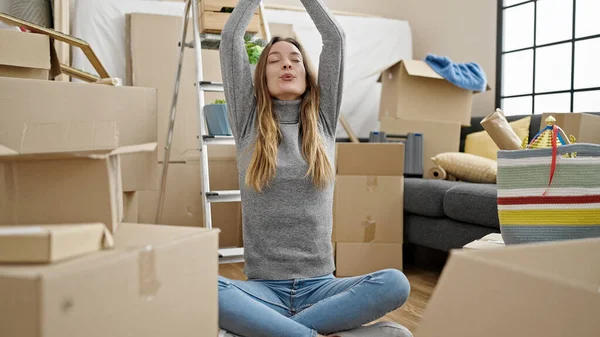Young Caucasian Woman Doing Yoga Exercise Sitting Floor New Home — Foto de Stock
