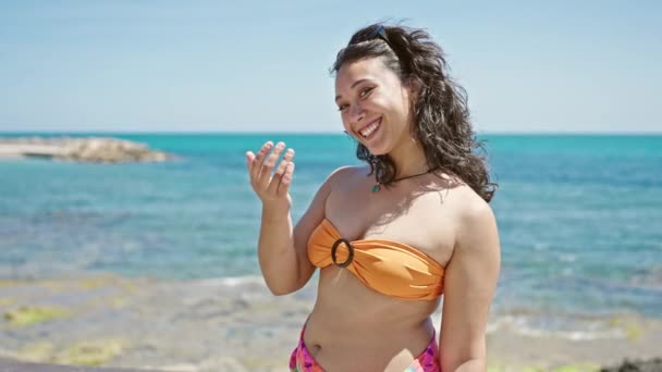 Young Beautiful Hispanic Woman Tourist Wearing Bikini Doing Come Gesture — Stock Video