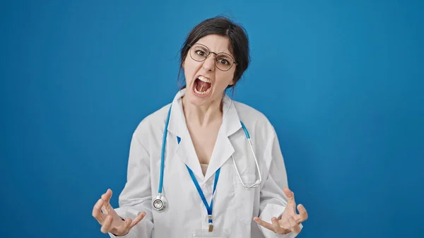 Young Beautiful Hispanic Woman Doctor Angry Stressed Isolated Blue Background — Stock Photo, Image