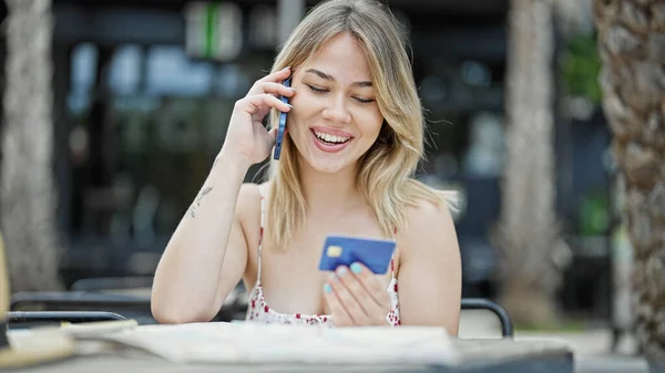 Young Blonde Woman Tourist Talking Smartphone Holding Credit Card Coffee — Stock Photo, Image