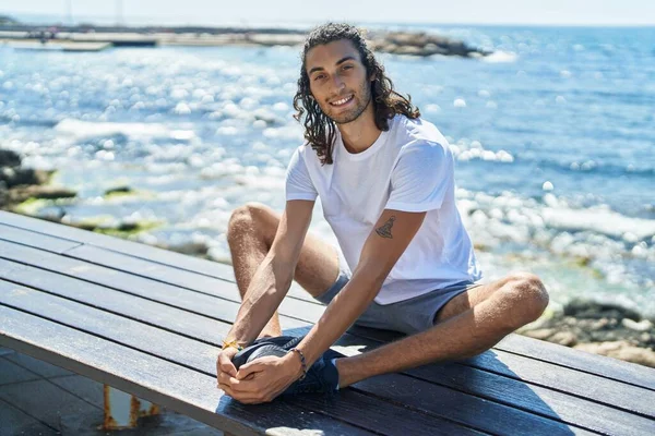 Young Hispanic Man Doing Yoga Exercise Sitting Bench Seaside — 스톡 사진
