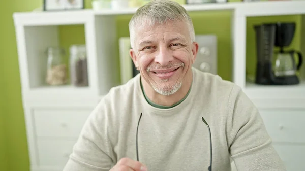 Middle Age Grey Haired Man Smiling Confident Sitting Table Home — Photo
