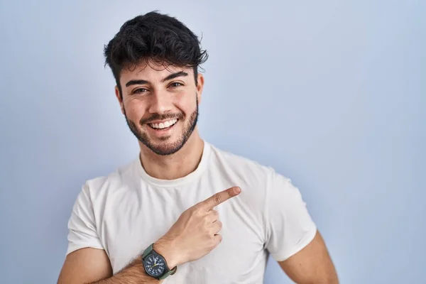 Hispanic Man Beard Standing White Background Cheerful Smile Face Pointing — Stok fotoğraf