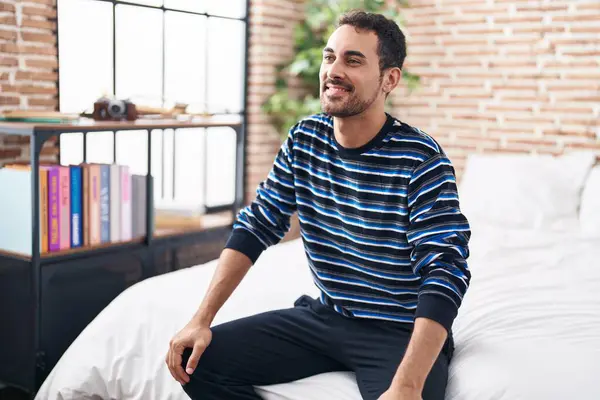 Young Hispanic Man Smiling Confident Sitting Bed Bedroom — Stockfoto