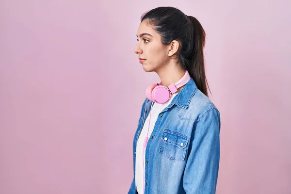 Young Beautiful Woman Standing Pink Background Looking Side Relax Profile — стоковое фото
