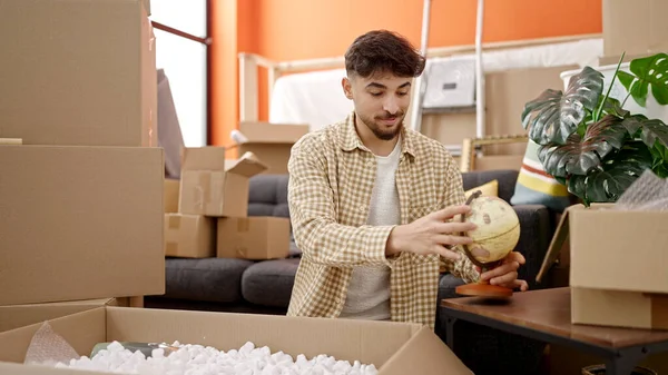 Young Arab Man Smiling Confident Unpacking Cardboard Box New Home — Stock Photo, Image