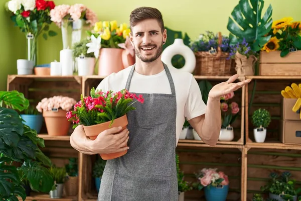 Hispanic Man Beard Working Florist Shop Holding Plant Celebrating Achievement — Stock Photo, Image