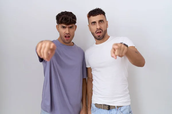 Homosexual Gay Couple Standing White Background Pointing Displeased Frustrated Camera — Stock Photo, Image