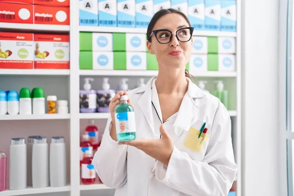 Brunette Woman Working Pharmacy Drugstore Holding Cough Syrup Smiling Looking — Stock Photo, Image