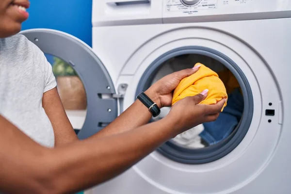 African American Woman Putting Clothes Washing Machine Laundry Room — Stockfoto