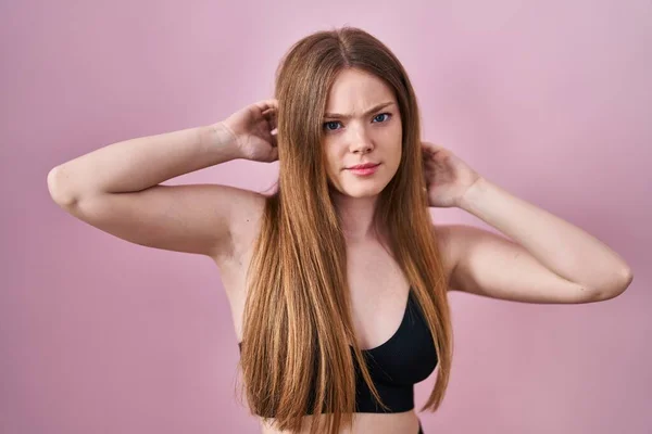 Young Caucasian Woman Wearing Lingerie Pink Background Skeptic Nervous Frowning — Stockfoto