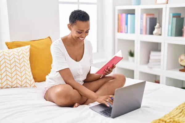 African American Woman Writing Notebook Using Laptop Bedroom — Stockfoto