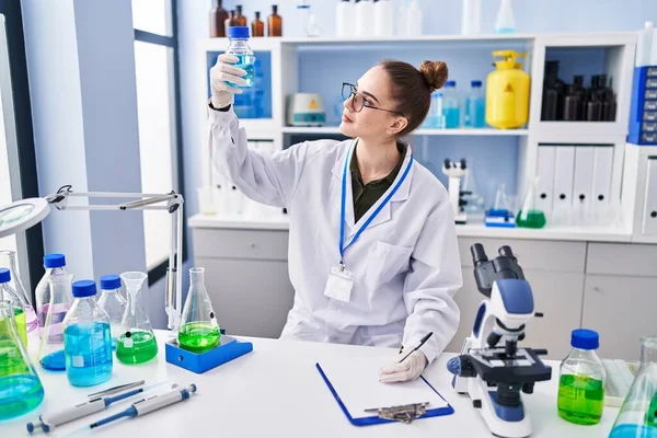 Young Woman Scientist Writing Clipboard Holding Test Tube Laboratory — Stok fotoğraf