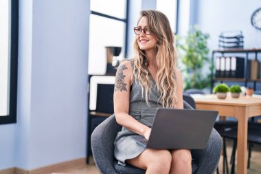 Young woman business worker using laptop at office