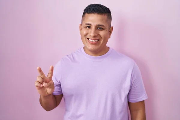 Young Hispanic Man Standing Pink Background Showing Pointing Fingers Number — Fotografia de Stock