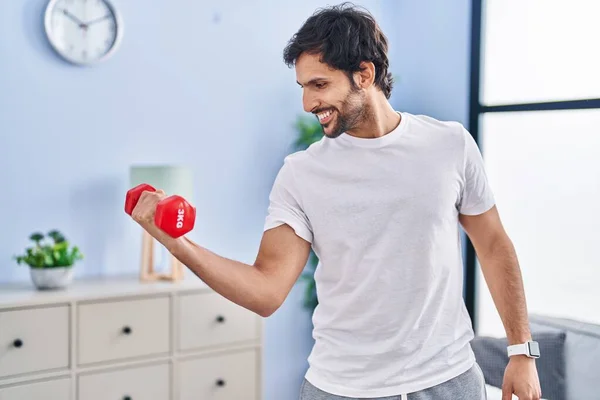 Young Hispanic Man Smiling Confident Using Dumbbell Training Home — Foto Stock