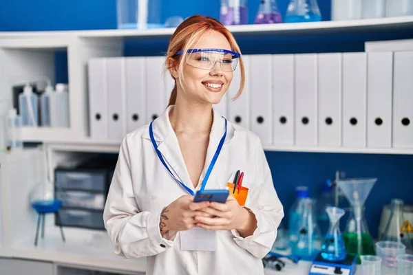 Young Caucasian Woman Scientist Smiling Confident Using Smartphone Laboratory —  Fotos de Stock