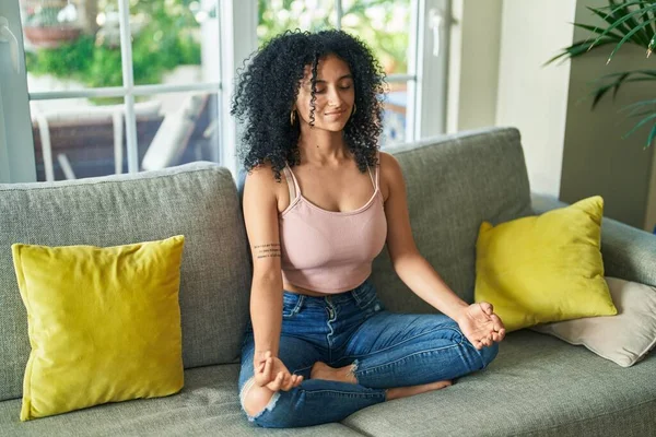 Young Hispanic Woman Doing Yoga Exercise Sitting Sofa Home — Fotografia de Stock