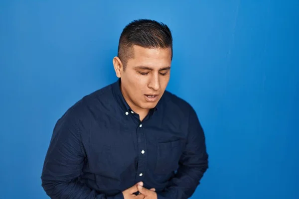 Hispanic Young Man Standing Blue Background Hand Stomach Because Indigestion — Stock Fotó