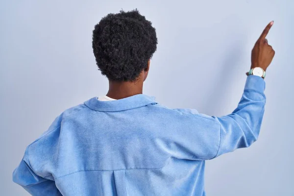 African American Woman Standing Blue Background Posing Backwards Pointing Ahead — Stock Photo, Image
