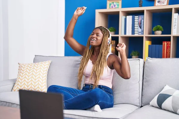 African American Woman Dancing Listening Music Sitting Sofa Home — Stock fotografie