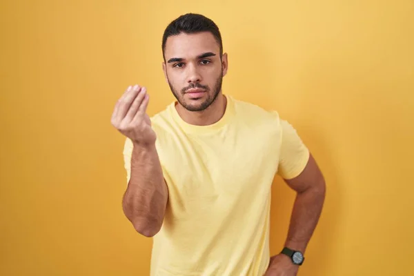 Young Hispanic Man Standing Yellow Background Doing Italian Gesture Hand — 스톡 사진