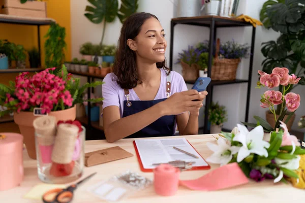 Young African American Woman Florist Smiling Confident Using Smartphone Flower — Fotografia de Stock