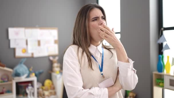 Young Beautiful Hispanic Woman Working Teacher Yawning Kindergarten — Stock Video