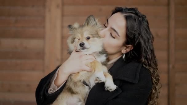 Young Hispanic Woman Dog Smiling Kissing Isolated Wooden Background — Stock Video