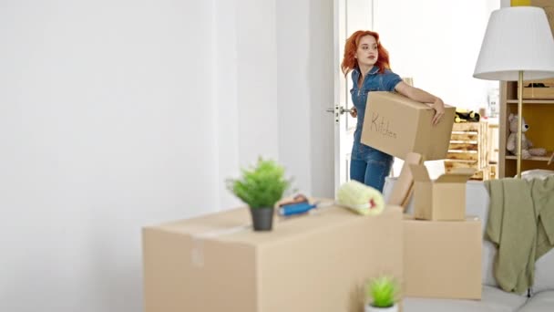 Young Redhead Woman Coming Home Holding Package New Home — Stock Video