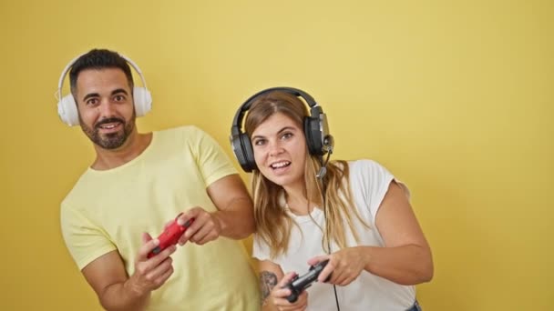 Man Woman Couple Playing Video Game Celebrating Isolated Yellow Background — Stock Video