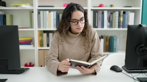 Young Beautiful Hispanic Woman Student Reading Book Doing Silence Gesture — Vídeo de Stock