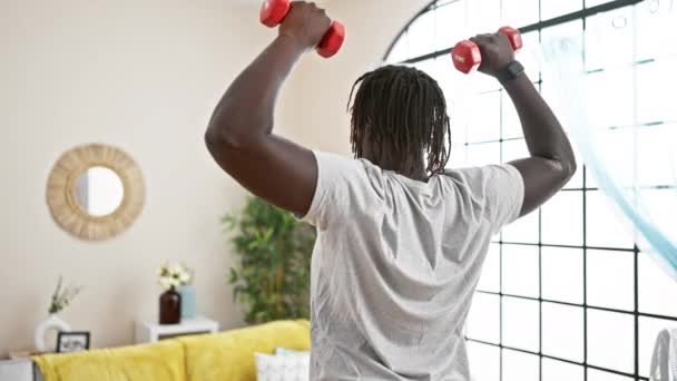 African American Man Using Dumbbells Training Home — Stock Video