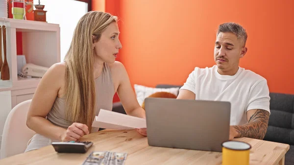 Man and woman couple accounting stressed at dinning room
