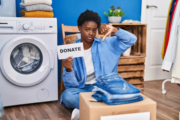 African American Woman Donating Clothes Angry Face Negative Sign Showing — Stock Photo, Image