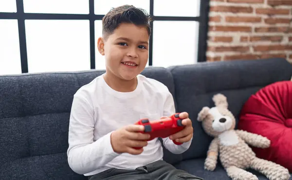 Adorable Hispanic Boy Playing Video Game Sitting Sofa Home — Foto de Stock
