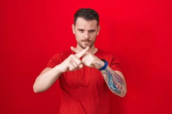 Young Hispanic Man Standing Red Background Rejection Expression Crossing Fingers — Stock fotografie
