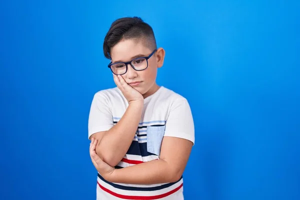 Young Hispanic Kid Standing Blue Background Thinking Looking Tired Bored — Stockfoto