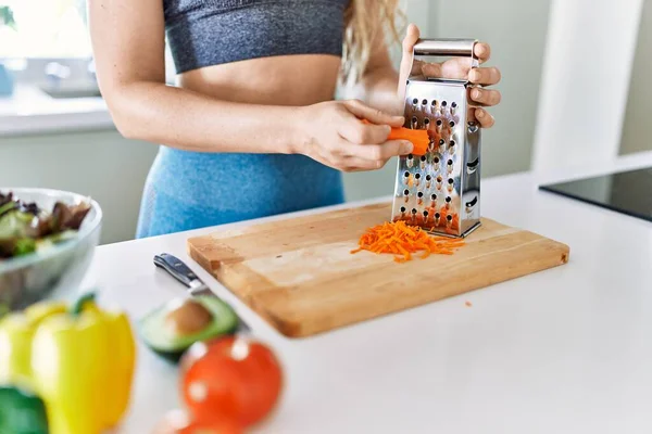 Young Woman Scratching Carrot Salad Kitchen — Stockfoto