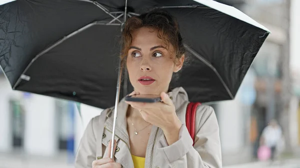 Young Woman Sending Voice Message Smartphone Holding Umbrella Street — Stock Photo, Image