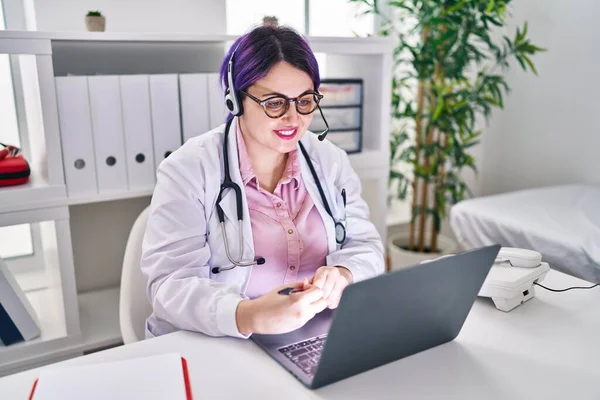 Young Beautiful Size Woman Doctor Smiling Confident Having Teleconsultation Clinic — Φωτογραφία Αρχείου