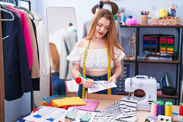 Young Redhead Woman Tailor Smiling Confident Drawing Notebook Clothing Factory — Stock Photo, Image